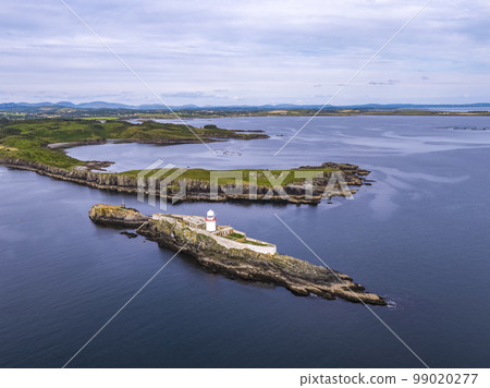 Aerial of the Rotten Island Lighthouse with Killybegs in background - County Donegal - Ireland 99020277