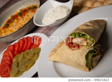 Lebanese recipe of chich taouk, garlic cream, toum, in a Lebanese bread, tabbouleh and chickpea 99021622