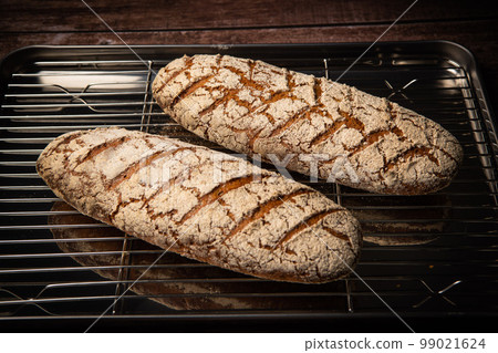 Rye bread on brown background 99021624