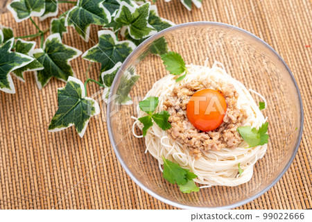 Somen noodles topped with meat miso and egg yolk Somen noodles topped with meat miso and egg yolk 99022666