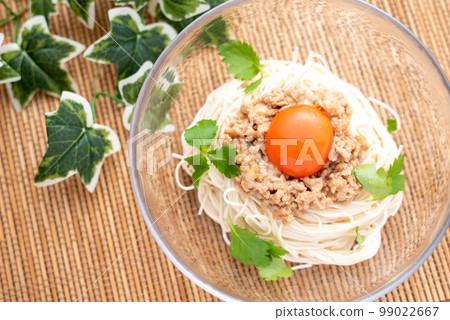 Somen noodles topped with meat miso and egg yolk Somen noodles topped with meat miso and egg yolk 99022667
