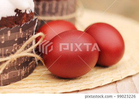 Red easter eggs painted with onion peel 99023226