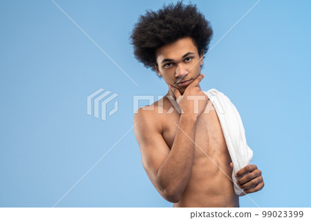 Dark-haired young man after workout 99023399