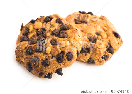cookies with chocolate and hazelnuts on a white background cookies with chocolate and hazelnuts on a white background 99024948