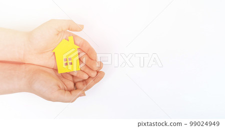 hands holding paper house, family home, homeless housing, mortgage crisis and home protecting insurance concept, foster home care, family day care, social distancing. 99024949