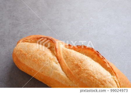 Freshly baked delicious baguette Freshly baked delicious baguette 99024973