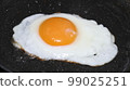 fried egg on frying pan 99025251