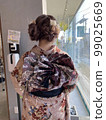 Dressing for the coming-of-age ceremony 99025669