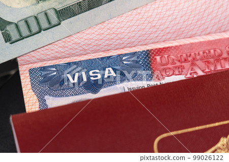 Russian passport with a US visa and a hundred dollars as a symbol of emigration 99026122