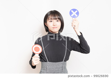 A young woman showing an NG plate 99026690