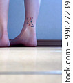 female ankle with tattoo 99027239
