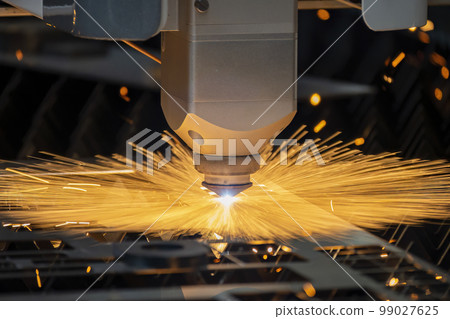 Close-up scene the fiber laser cutting machine cutting  machine cut the metal plate. 99027625