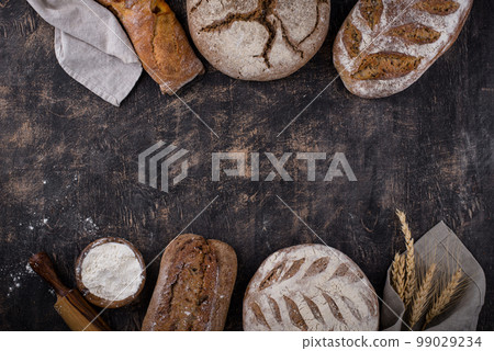 Fresh homemade bread with a crispy crust Fresh homemade bread with a crispy crust 99029234