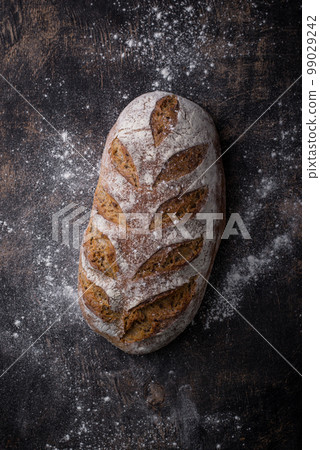 Fresh homemade bread with a crispy crust Fresh homemade bread with a crispy crust 99029242