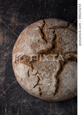 Fresh homemade bread with a crispy crust 99029254