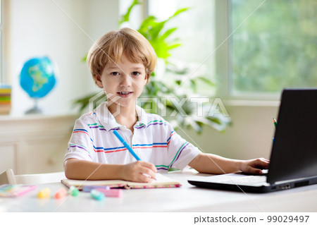 Online remote learning. School kids with computer. Online remote learning. School kids with computer. 99029497
