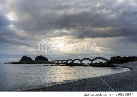 Landscape view of the beautiful eight cross-Sea arch bridge across the pacific ocean coast at Sanxiantai islet (Three Saints Island), East Coast National Scenic Area, Taitung, Taiwan. 99029844