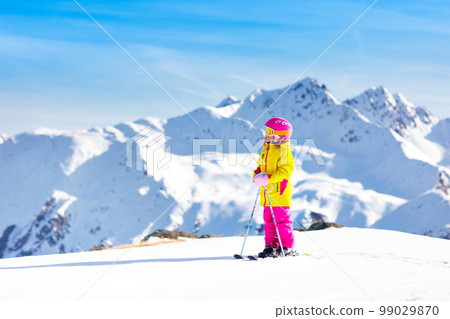Ski and snow fun. Kids skiing. Child winter sport. 99029870