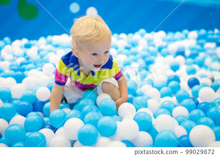 Kids play in ball pit. Child playing in balls pool 99029872