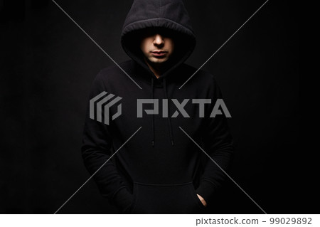Person in Hood. Man or Boy in a hooded sweatshirt 99029892