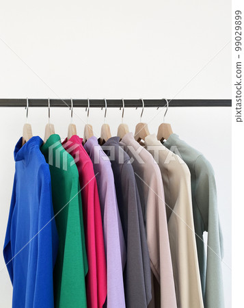 color shirts on a hanger in the store. trendy ladieswear still life 99029899