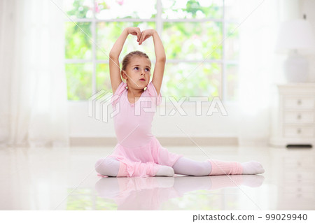 Baby ballet. Little ballerina girl in dance class. 99029940