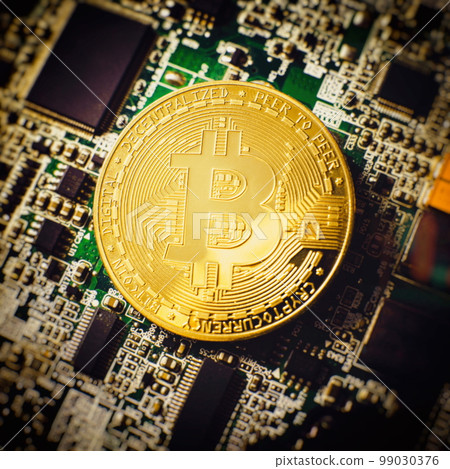 Blockchain technology bitcoin mining concept. Bitcoin golden coin on computer circuit board. banner copy space Blockchain technology bitcoin mining concept. Bitcoin golden coin on computer circuit board. banner copy space 99030376