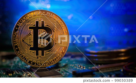 Golden cryptocurrencies Bitcoin golden coin on computer circuit board. banner copy space 99030389