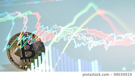 Virtual cryptocurrency concept. Bitcoin cryptocurrency with colorfull blurred candlestick chart in the background and reflection Virtual cryptocurrency concept. Bitcoin cryptocurrency with colorfull blurred candlestick chart in the background and reflection 99030919