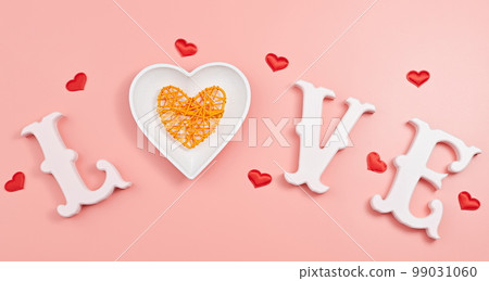 Happy Valentine's Day, Mother's Day, March 8, World Women's Day holiday card concept. Flat lay. word love in white letters on a trendy pink background. Happy Valentine's Day, Mother's Day, March 8, World Women's Day holiday card concept. Flat lay. word love in white letters on a trendy pink background. 99031060