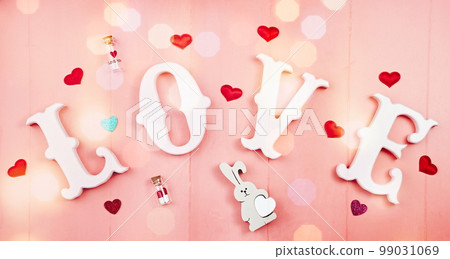 Happy Valentine's Day, Mother's Day, March 8, World Women's Day holiday card concept. Flat lay. word love in white letters on a trendy pink background. Happy Valentine's Day, Mother's Day, March 8, World Women's Day holiday card concept. Flat lay. word love in white letters on a trendy pink background. 99031069