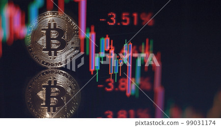 Gold bitcoins with Candle stick graph chart and digital background.Golden coin with icon letter B.Mining or blockchain technology Gold bitcoins with Candle stick graph chart and digital background.Golden coin with icon letter B.Mining or blockchain technology 99031174