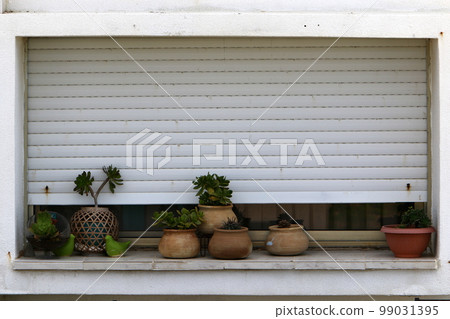 Small window in the big city. 99031395