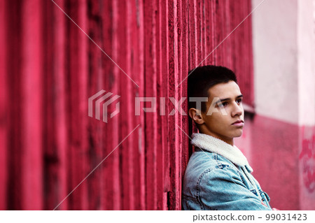 Young pensive guy, toned in pink Young pensive guy, toned in pink 99031423