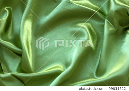 Texture of green silk satin fabric Texture of green silk satin fabric 99031522