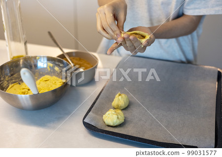 Making dough by hand and shaping it Making dough by hand and shaping it 99031577