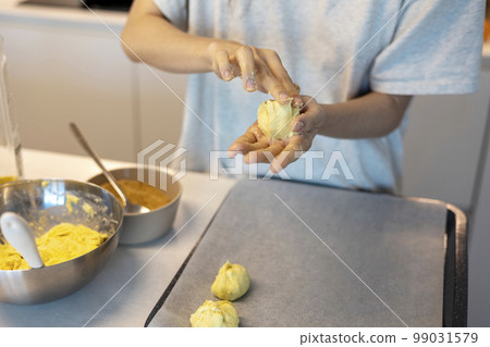Making dough by hand and shaping it Making dough by hand and shaping it 99031579