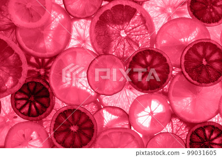 beautiful fresh sliced mixed citrus fruits, toned in pink beautiful fresh sliced mixed citrus fruits, toned in pink 99031605