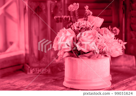 flower composition on the window with a decorative candlestick, toned in pink flower composition on the window with a decorative candlestick, toned in pink 99031624