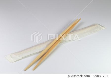 ready-made or disposable Brown bamboo chopsticks isolated on white background. 99031795