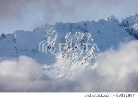 Tantalus Range covered in Snow and Clouds during Winter Season. 99031997