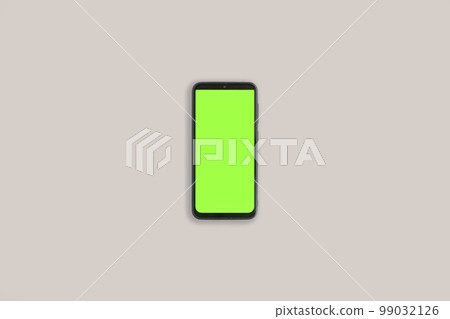 Phone with vertical green screen with chroma key isolated gray background. Mock Up Display. Smartphone gadget for advertising. Top above view. Mobile phone with empty blank screen. Layout template Phone with vertical green screen with chroma key isolated gray background. Mock Up Display. Smartphone gadget for advertising. Top above view. Mobile phone with empty blank screen. Layout template 99032126