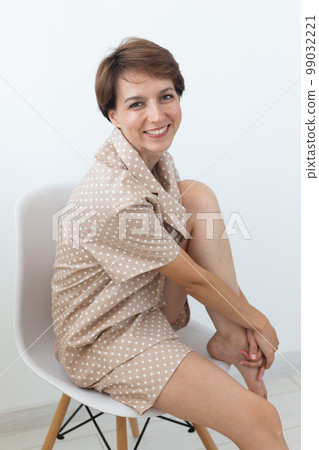 Woman wears pajama. Close-up detail and fabric texture of a pajama. Homewear, sleepwear, shopping and sale Woman wears pajama. Close-up detail and fabric texture of a pajama. Homewear, sleepwear, shopping and sale 99032221
