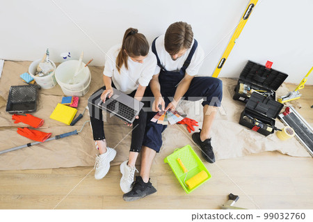 House, interior design and couple on laptop working on renovation planning creative design for home living room. 99032760