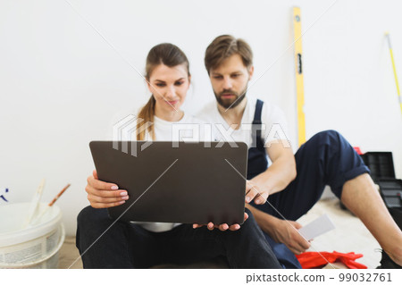 Couple doing home renovation with paint, creative man and woman designer painting home 99032761