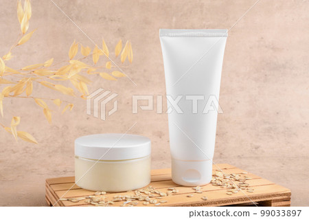 White squeeze bottle plastic tube mockup for cosmetics and jar with facial moisturizer cream on beige background 99033897