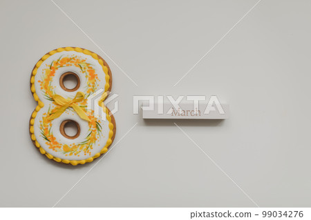 Women's Day, March 8, figure eight, gingerbread, flowers. Space for text. Women's Day, March 8, figure eight, gingerbread, flowers. Space for text. 99034276