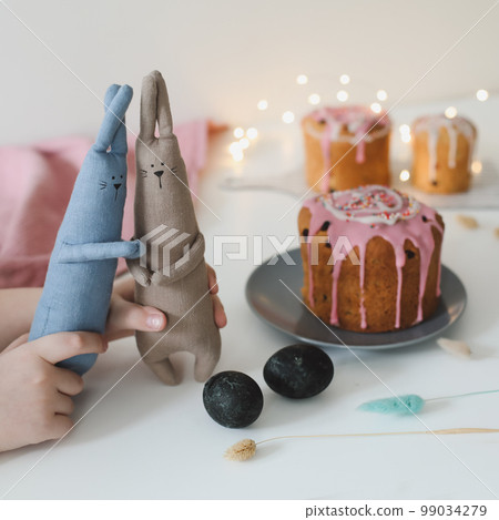 Easter cake, colorful eggs and rabbit toy. Happy Easter holiday concept. festive spring season 99034279