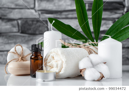 Spa and wellness accessories on gray stone background. Concept of face and body care. Spa and wellness accessories on gray stone background. Concept of face and body care. 99034472