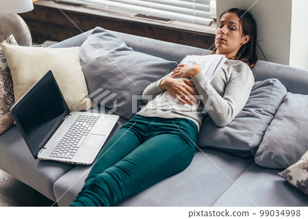 Woman fell asleep with documents in her hands while working 99034998